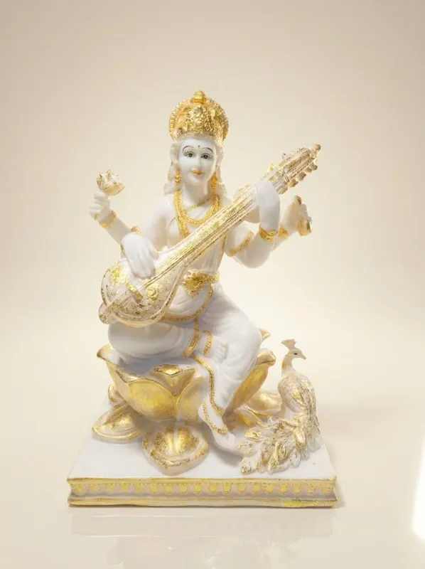 Goddess Saraswati Seated on Lotus with Peacock Statue