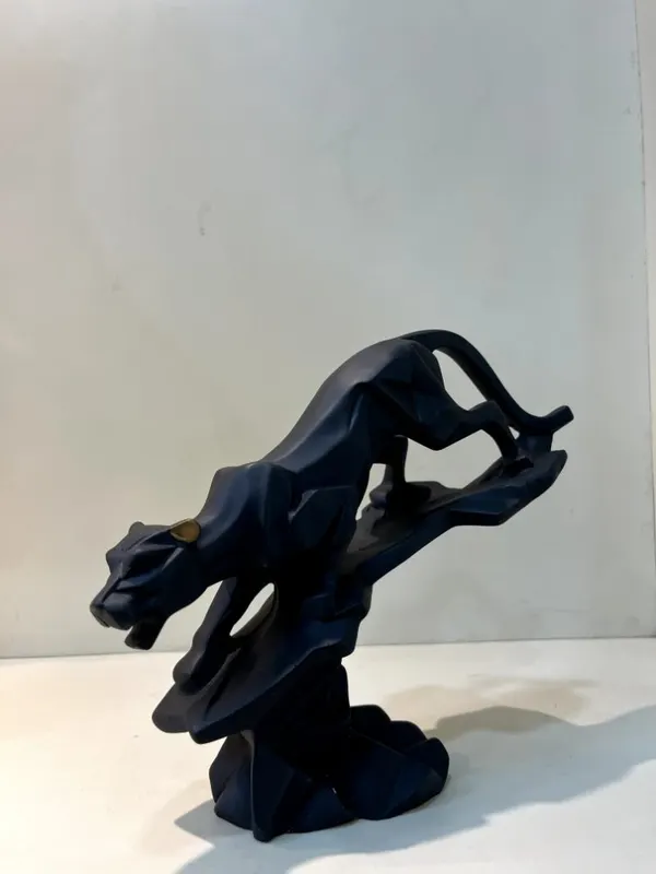 Modern Geometric Matte Black Panther on Rock Tabletop